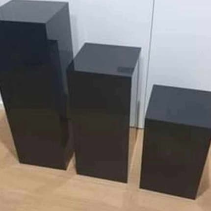 Set of three square black acrylic plinths