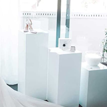 Set of three square white acrylic plinths